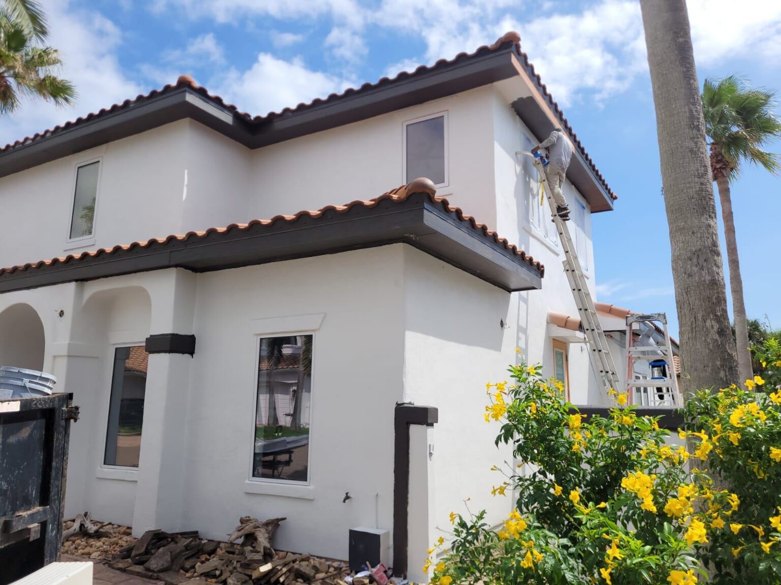 Mediterranean-style stucco home exterior, tile roof detail